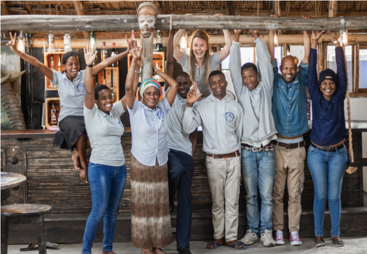 The VIT Arusha House team with arms raised